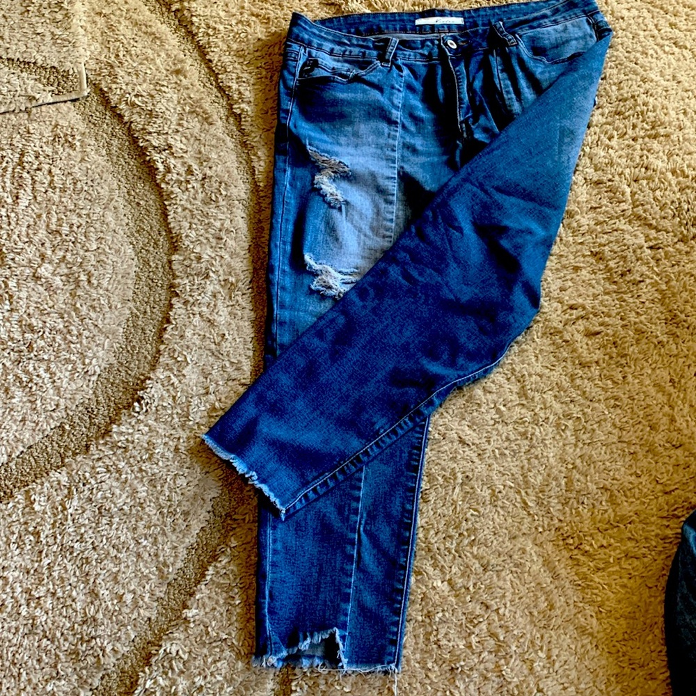 Women jeans with raveled hem on legs. Very wearable jeans